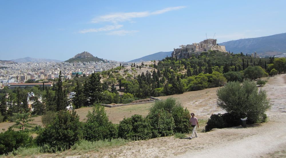 View of the Pnyx with Mount Lykabettos in the back